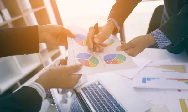 Investment Advise A group of people are working on a project.